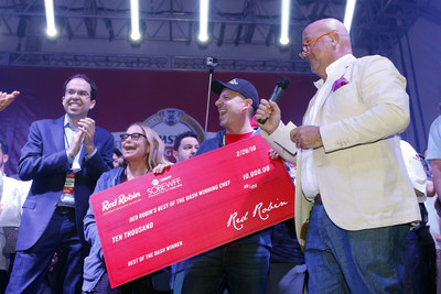 Travel Channel personality Andrew Zimmern, right, along with Red Robin CMO Jonathan Muhtar award a $10,000 check to Chefs Karen Sidell and David Daniels of MET Back Bay at the Amstel Light Burger Bash, during the Food Network & Cooking Channel South Beach Wine & Food Festival on Feb. 26, 2016 in Miami Beach, Fla. Sidell and Daniels also won the opportunity to have their award-winning burger featured as a limited-time-offer on Red Robin's Finest premium burger menu later this year. (Brian Blanco/AP Images for Red Robin)