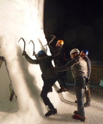 Through bonding and camaraderie, wounded veterans help each other conquer the ice wall.