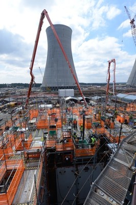 Workers complete the 45-hour continuous pour of 1,800+ cubic yards of concrete for the CA20 module at the Vogtle nuclear expansion on Sunday, March 6. The Unit 3 cooling tower is pictured in the background.