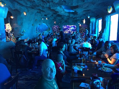 Wounded Warrior Project Alumni and their families enjoy a meal among the fishes at the Kemah Aquarium, during an Alumni Program event.