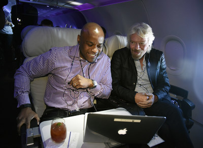 In this photo released by Virgin America Airlines, Virgin Group Founder Sir Richard Branson and Denver Mayor Michael Hancock participate in a live-streamed discussion at 35,000 feet onboard the airline's inaugural flight between San Francisco International Airport (SFO) and Denver International Airport Flight (DEN) - a new route that connects two of the nation's leading innovation economies, on Tuesday, March 15, 2016. To kick off the new business travel route onboard the inaugural flight today, the airline known for its modern and tech-forward service - including new, even higher speed in-flight WiFi, convened a live-streamed discussion at 35,000 feet on the future of entrepreneurship with partner LinkedIn, Virgin Group Founder Sir Richard Branson, Denver Mayor Michael Hancock and up-and-coming business leaders. (Photo by Virgin America/Bob Riha, Jr.)