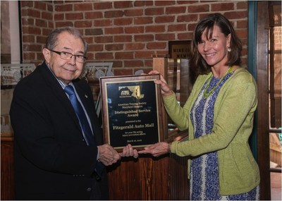 Jack Fitzgerald accepts Maryland American Trauma Society's Distinguished Service Award for 2016 for Fitzgerald Auto Malls from Susanne Ogaitis Jones