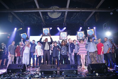 Belk's 2016 Southern Musician Showcase winners celebrate with blue record awards at the competition's finale event.