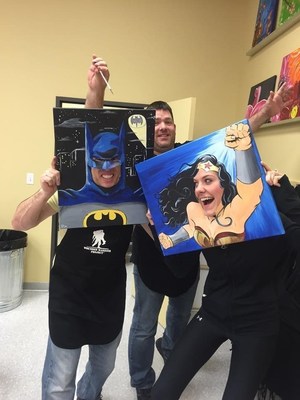 Veteran and WWP Alumnus Tim Stroud (left) was Batman for just a moment at the couples painting event.