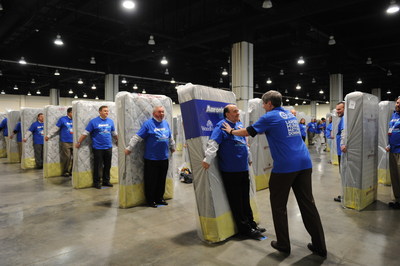 Aaron's, Inc. associates broke the GUINNESS WORLD RECORDS(TM) title for the Largest human mattress dominoes this week with CEO John Robinson starting the 1,200 mattress topple by pushing the first human domino at the Gaylord National Resort in Washington, D.C. Aaron's is donating all 1,200 mattresses to D.C.-area organizations:  A Wider Circle, an organization focused on ending individual and family poverty, and to the Sasha Bruce and Wanda Alston youth homeless shelters.