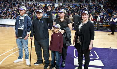 Northwestern University recognizes wounded veteran at basketball game.