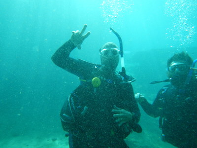 Wounded Warrior Project Alumni below the surface, signaling their diving success at a recent Alumni Program event.