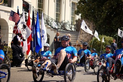 Wounded veterans are greeted by President Obama as they ride past the White House during the 2015 Wounded Warrior Project Soldier Ride event.