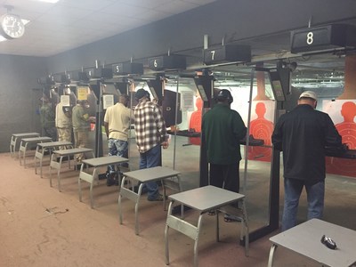 Wounded veterans come together at indoor shooting range.