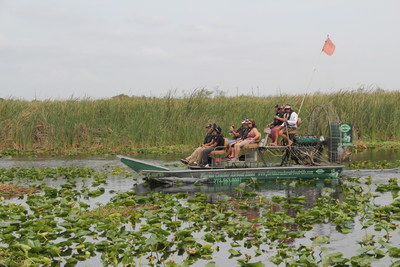 Wounded veterans get up close and personal with alligators during airboat tour.