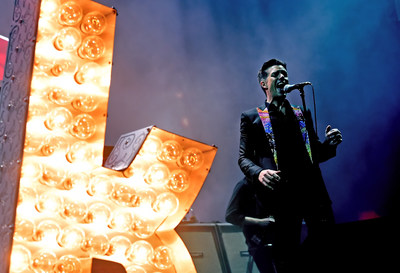 The Killers Perform at T-Mobile Arena Grand Opening. Photo Credit Kevin Winters Getty. ABA: Brandon Flowers of The Killers told the crowd when he heard T-Mobile Arena was opening, he wanted the Las Vegas-born band to be part of it. Photo credit: Kevin Winters / Getty