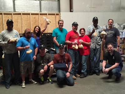 Wounded veterans and family gather to give back at local food bank.
