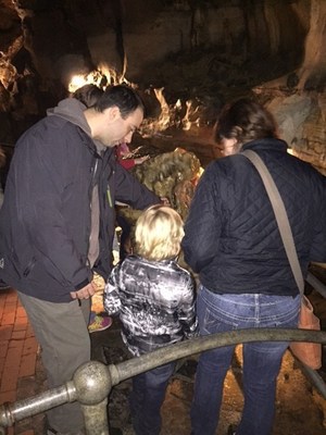 Wounded Warrior Project Alumni and their families inspect the rock formations of Howe Caverns during an Alumni program event.