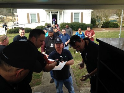 Wounded veterans learn BBQ skills during a Wounded Warrior Project event in North Carolina.