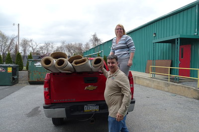 Sue Matthew, project manager at Sands Bethlehem, a casino and entertainment destination, loads carpet for Luciano "Lucky" Rios, of Metro Design, in Bethlehem, Pa., on Friday, March 18, 2016. Sands Bethlehem sent 17 rolls of unused carpet, totaling more than 18,000 square feet, to Metro Designs to cut into 11 rugs, which will be donated to local non-profits.