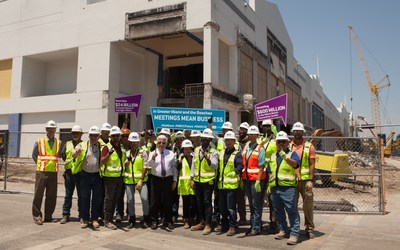 To celebrate Global Meetings Industry Day, Greater Miami Convention & Visitors Bureau (GMCVB) President and CEO William Talbert poses at the construction site of the Miami Beach Convention Center alongside the Clark Construction team working on the renovation and expansion of the existing building.