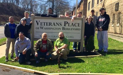 Wounded veterans gather to landscape local homeless veterans home.