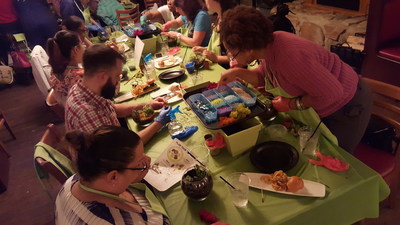 Families of injured service members learn how to create a terrarium.