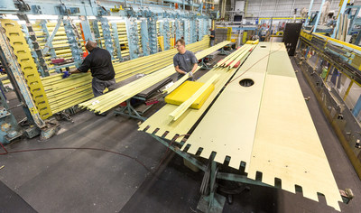 Production Operations team members work on a wing that is part of the first LM-100J commercial freighter at the Lockheed Martin site in Marietta, Georgia. The LM-100J is the commercial variant of the proven C-130J Super Hercules. (Photo by Todd R. McQueen)