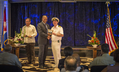 Pictured is Fathom's MV Adonia Captain David Box with Enrique Valdes Cardenas, Subdirector for North America, MINCEX, at a plaque exchange ceremony commemorating Carnival Corporation's first cruise to Cuba. This longtime maritime tradition takes place when a ship arrives at a new port for the first time. Yesterday, Fathom's MV Adonia docked at Port of Havana - marking the first time a U.S. Cruise ship has sailed to Cuba in more than 50 years.