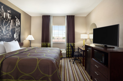 The Super 8 brand's North American redesign centers around a reimagined guestroom featuring soothing color palettes, sleek finishings and bedding, as well as modern amenities and local artwork. Above, the Super 8 in Owasso, Okla.