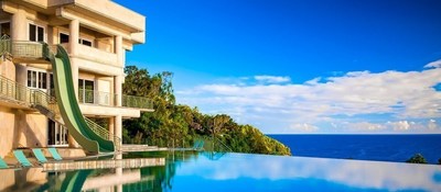 Exotic Estates - Rainbow Falls Villa - View. Villa overlooks a double waterfall that cascades down into the Pacific Ocean.