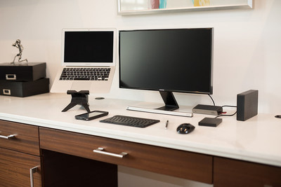 A home workspace setup -- complete with a universal docking station, a laptop, laptop stand, monitor, and wireless keyboard and mouse -- can improve the productivity of remote workers.