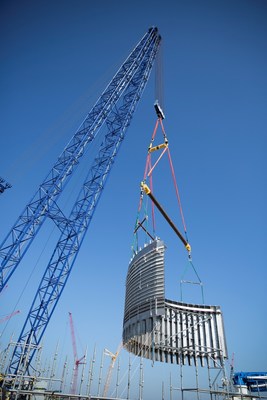 Workers safely place the 237-ton CA03 module at the Vogtle nuclear expansion. The module was lifted into place by a 560-foot tall heavy lift derrick, one of the largest cranes in the world.