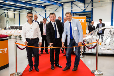 Pictured front left to right: Robert Wirth, Project Partner, Stephan Humpf, TE Plant Manager, and Roland Brandli, Mayor of Steinach during the ribbon cutting ceremony with TE Automotive leaders and other event attendees.