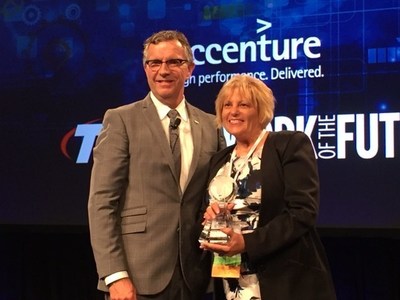 Argent Associates President and CEO, Betty Manetta, being presented the 2016 Global Sustainability Award for Most Improved from QuEST Forum CEO, Fraser Pajak