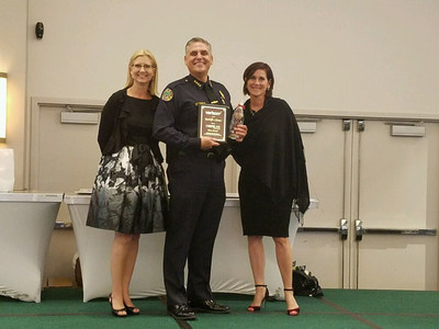 Chief of Police Rodolfo Llanes proudly receives Verizon Wireless' HopeLine Hero Award for his dedication and efforts around domestic violence awareness and prevention. Do The Right Thing, a non-profit organization that recognizes and rewards Miami youths for their exemplary behavior and good deeds, accepted a $10,000 HopeLine grant given to the organization in his honor.