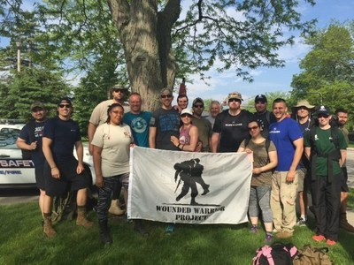Wounded veterans prepare to march to raise awareness for PTSD and the memories of their fallen comrades during the 3rd Annual Ruck for Honor.