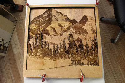 3D art created by laser cutting, engraving, and gluing multiple layers of plywood. Photo courtesy of AP Lazer.