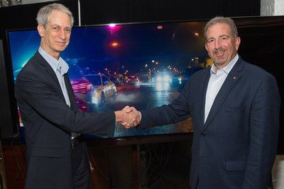 Value Electronics Owner Robert Zohn (left) presents the 2016 TV Shootout™ award for the LG SIGNATURE OLED TV (model OLED65G6P) to Tim Alessi, Senior Director, Product Marketing for home entertainment, LG Electronics USA (right).