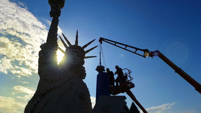 LEGO Master Model builders at LEGOLAND California Resort install the new One World Trade Center in time for the Fourth of July. The new model towers over Miniland New York in Miniland U.S.A. and the LEGO Statue of Liberty.