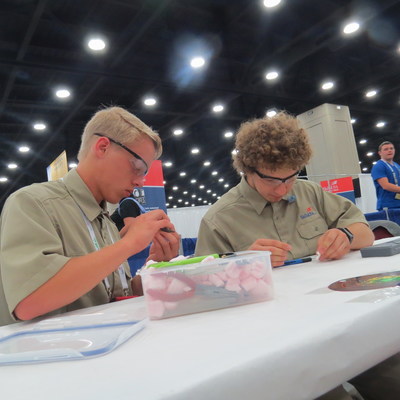 SkillsUSA Additive Manufacturing Competition contestants Justin Heck (left) and Christopher Dagher (right), from Payette River Technical Academy in Emmett, Idaho, arrived early on day 3 of the contest to prep their designs for judging. Heck and Dagher won the gold medal, ranking in the top spot of the high school participants.