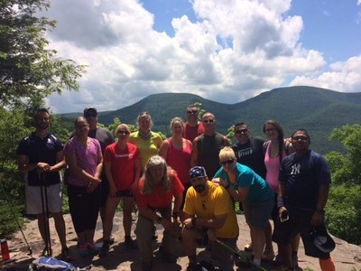 The group of veterans pose for a picture atop a mountain in the Catskills. Photo courtesy of Adaptive Sports Foundation.