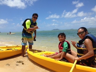 Warrior and his son get ready to go kayaking.