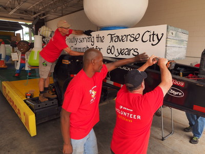 Members of the DTE Energy volunteer Care Force assemble the DTE float that will appear Friday in the DTE Energy Foundation Cherry Royale Parade. The float's theme is "Committing Our Energy to Traverse City."
