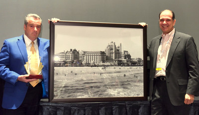 James F. Allen (left) receives the Casino Marketing Lifetime Achievement Award and a framed historical photograph of Atlantic City, N.J., from Charles Anderer (right), Executive Editor of Casino Journal Magazine.  Allen grew up in the area of Atlantic City and began his gaming industry career there.