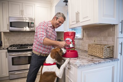 Television host Andy Cohen feeds his rescue dog Wacha Purina ONE dog food as part of Purina ONE's 28 Day Challenge. Andy is teaming up with Purina ONE to support the ONE Difference initiative which celebrates the difference shelter-led educational programs can make in the lives of both students and shelter dogs.