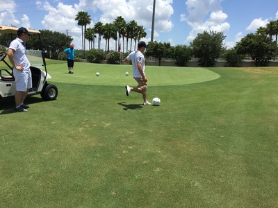 A veteran prepares to kick the ball in a game of footgolf with Wounded Warrior Project in Orlando, Florida on a recent hot summer day.