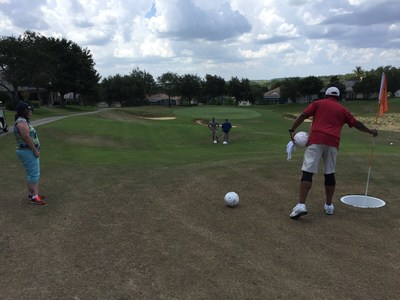 Warriors scope out the competition at a game of footgolf with Wounded Warrior Project in Orlando, Florida on a hot summer day.