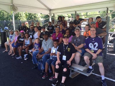 After watching the Ravens practice, veterans and family members posed for photos with players and received autographs.