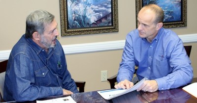 Russell Roseberry, Innerfaith Prison Ministry Executive Director, and Joe Zanco make plans for teaching inmates the essentials of managing their finances.
