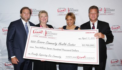 Maryland Live! Casino and Anne Arundel County today awarded more than $18.6 million in local impact grants for fiscal year 2017 to various grant recipients as recommended by the Local Development Council (LDC), which helps to manage the allocation of county gaming tax revenue to local organizations. Joe Weinberg, Managing Partner of The Cordish Companies (far left); Anne Arundel County Executive Steve Schuh (far right); and Claire Louder, Chair of the LDC, (2nd from left) officially presented the grants, including one for $2.7 million to Severn Community Center Executive Director Faye Royale-Larkins. (2nd from right).