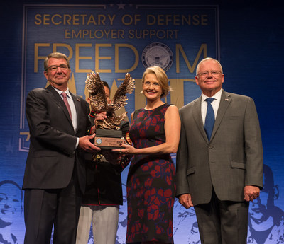 Secretary of Defense Ashton B Carter recognizes CEO Catherine Monson of FASTSIGNS International Inc at the DoD Freedom Awards August 26 2016 in the Pentagon Auditorium US Army photo by Sgt Ricky Bowden