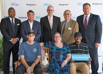 Aflac and Palmetto Health Foundation in Columbia South Carolina today celebrated those who go the extra mile in fighting childhood cancer at their annual Duckprints celebration. (standing): Virgil Miller, Aflac Insurance; Scott Sawyer, representing Stacy Sawyer, honoree; Ronnie Neuberg, M.D., Palmetto Health Children's Hospital, honoree; Samuel Tenenbaum, Palmetto Health Foundation; Todd Ellis, voice of USC Gamecocks Football; (sitting): Paul and Sarah Towns, honoree; DJ Fisher, Children's Hospital patient