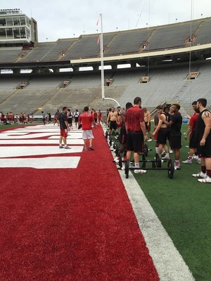 The University of Wisconsin football team talks with wounded veterans and their guests.