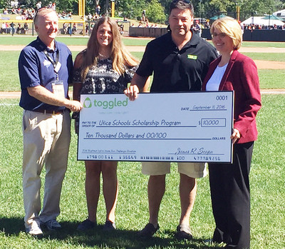 Superintendent Dr. Christine Johns, on behalf of Utica Community Schools, was presented a $10,000 scholarship donation from toggled by Andy Appleby, USPBL founder and president, Mike Kidder, Senior Vice President of Corporate Marketing for Altair/toggled with his daughter Morgan Kidder.